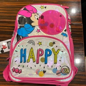 Minnie Mouse happy briefcase blowing bubbles.